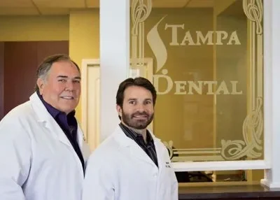 Dr. Laz Kavouklis and Dr. Nick Kavouklis at the Tampa Dental entrance.